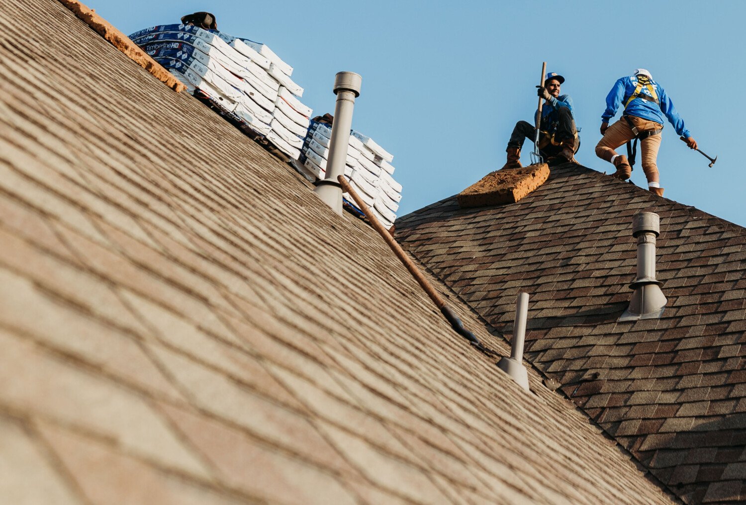 Bondoc Roofers use tools to work on roof